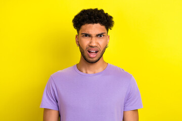 Wall Mural - Photo of shocked confused guy dressed purple t-shirt open mouth isolated yellow color background