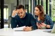 © bnenin - A serious male boss solves the financial problem with his female employee.