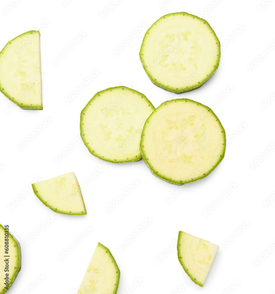 Slices of fresh zucchini on white background