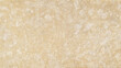 Texture of natural beige tuff stone, background.