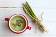 Asparagus soup in a red bowl