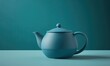 a blue teapot sitting on top of a table next to a green wall.  generative ai