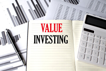 Poster - VALUE INVESTING text written on a notebook on chart and diagram