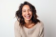 © Robert MEYNER - Close up portrait of a laughing young woman isolated on a white background