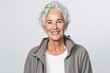 portrait of smiling senior woman looking at camera isolated on grey background
