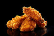 Delicious crispy Golden Brown fried chicken isolated on black background