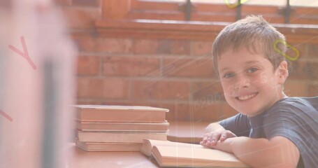 Sticker - Animation of changing numbers and letters over caucasian boy reading book in classroom