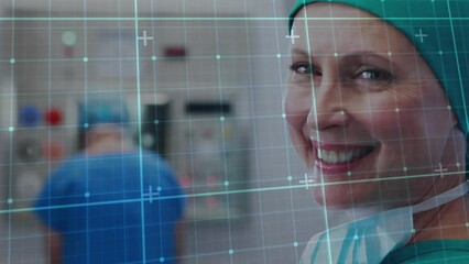 Poster - animation of grid pattern over close-up of smiling caucasian female surgeon in hospital