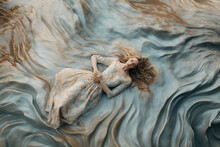 Fashion Shoot Of A Woman Wearing A Dress And Lying On A Textured Blanked
