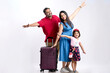 © Niks Ads - Indian family with luggage on white background.