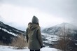 Rear view of a young woman in snowy mountains, Generative AI
