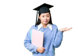 Wall Mural - Young student woman over isolated chroma key background having doubts while raising hands