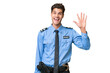 Young police man over isolated background saluting with hand with happy expression