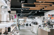 © Maskot - Interior of electronics store with various appliances arranged for sale