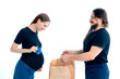 © kajasja - Portrait happy young pregnant woman and her husband with shopping bags and touching her big belly isolated on white background. Pregnancy shopping concept happy young family with shopping bags