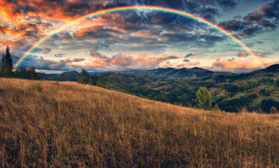 Wall Mural - Rainbow over the Mountains. autumn morning in the Carpathians. Nature of Ukraine