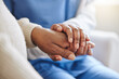 © Siphosethu Fanti/peopleimages.com - Senior patient, nurse and holding hands for support, healthcare or empathy at nursing home. Elderly person and caregiver together for trust, homecare and counseling or help for health in retirement