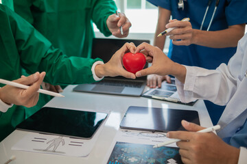 Wall Mural - concept of medical team meeting to discuss about treating heart disease with surgery and preventing recurrence of heart disease later. medical team meeting about cardiology to treat patients.