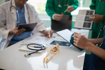 Wall Mural - concept of mobilizing ability of medical team in conference room to diagnose and treat disease correctly. medical team joins meeting and discusses  patient illness in order to treat it correctly