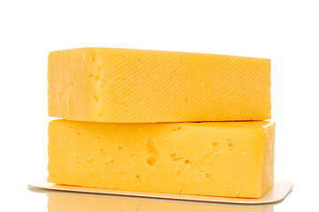 Two pieces of cheese on a white paper plate, macro, isolated on a white background.