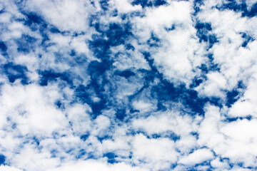 deep blue sky with white clouds