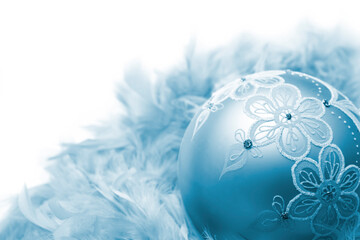 Sticker - Christmas ball on feathers, isolated on white background