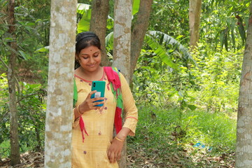 Young Indian Village Girl With Mobile