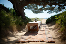 Wooden Table And White Towel On The Sand, Ocean Background. Close-up Summer Scene With A Wooden Table Laid With A Tablecloth On A Sand Dune In The Sun Under A Huge Oak Tree. Generative AI