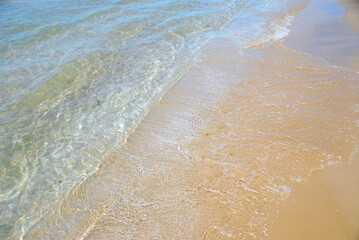 Canvas Print - Waves on sandy beach, closeup