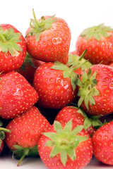 Wall Mural - Fresh Strawberrys set against a plain background