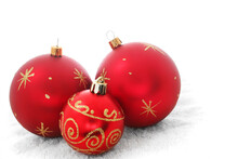 Three Red Baubles On A White Background
