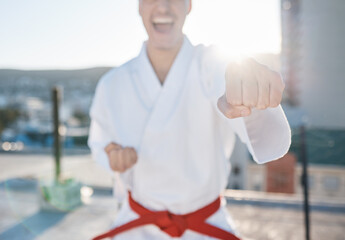 Poster - Karate, fitness and fight with a sports man in gi, training in the city on a blurred background. Exercise, discipline or power with a male athlete during a self defense workout for health closeup