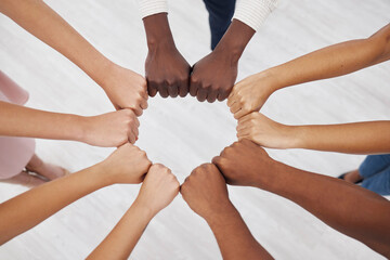 Poster - Hands, collaboration and overhead with a business team standing in a circle for unity or solidarity at work. Teamwork, fist bump and support with a diverse group of colleagues in a huddle from above