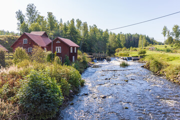 Sticker - Old mill by a river in the countryside