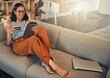Ecommerce, credit card and woman on a sofa, tablet and transactions with online shopping, home and relax. Female person, happy client or customer on a sofa, technology or buying with internet banking