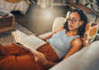 © Haas/peopleimages.com - Woman relax on sofa, reading book at house and break on the weekend with literature, fantasy story and peace. Female person with hobby, leisure and chill at home, read for knowledge and information