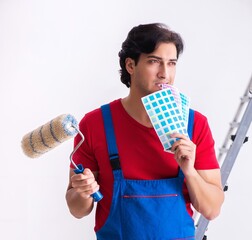 Canvas Print - Young handsome contractor working indoors