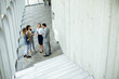 © BGStock72 - Young startup team have a discussion by stairs in the office corridor