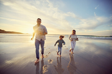 Wall Mural - Mother, father and child run on beach on holiday, summer vacation and weekend together. Nature, family travel and happy mom, dad and girl playing for bonding, adventure and quality time at sunrise