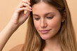 © luismolinero - Portrait of blond pretty woman over isotaed background