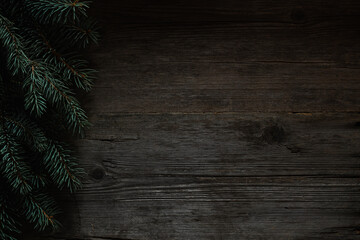 Wall Mural - Christmas green frame from fir branches on a vintage gray board back. Frame of fir branches. Christmas card blank.