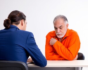 Wall Mural - Old captive meeting with advocate in pre-trial detention