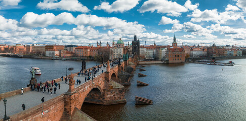 Wall Mural - Scenic spring panoramic aerial view of the Old Town pier architecture and Charles Bridge over Vltava river in Prague, Czech Republic