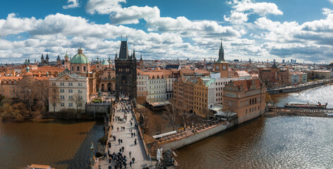 Wall Mural - Scenic spring panoramic aerial view of the Old Town pier architecture and Charles Bridge over Vltava river in Prague, Czech Republic