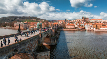 Wall Mural - Scenic spring panoramic aerial view of the Old Town pier architecture and Charles Bridge over Vltava river in Prague, Czech Republic