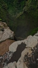 Vertical Video. Extreme Freestyle Flip Drone Trick Tropical Island Waterfall Speed Water Fall Stream Rainforest Mountain Valley Aerial View. FPV Sport Shot Jungle Cascade Fern Greenery Cliff Creek 4k