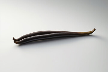 Leinwandbilder - An image capturing a vanilla bean, showcasing its long and slender shape and rich, sweet aroma.  Generative AI technology.