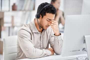 Canvas Print - Mental health, man with headache and headset at his desk with computer in a modern workplace office. Telemarketing or call center, sad or burnout and male person tired or depressed at his workstation