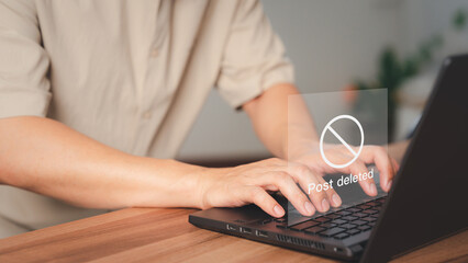 Poster - Young man using a laptop to play social media, but the post has been deleted. Searching for more internet, search engine optimization.