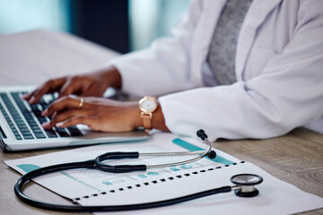 Poster - Closeup, hands and doctor with a laptop, stethoscope and typing with connection, documents and telehealth. Black woman, female person or employee with a folder, medical equipment and digital planning